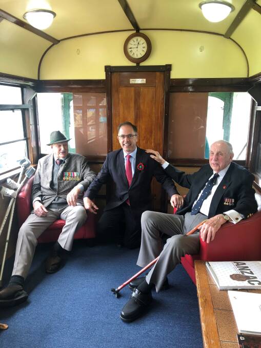 Taking a ride: World War Two veterans Len Pomeroy (left) and Sam Wiltshire (right) inside the new Terang RSL tram, with Member for Polwarth Richard Riordan. Picture: Supplied.