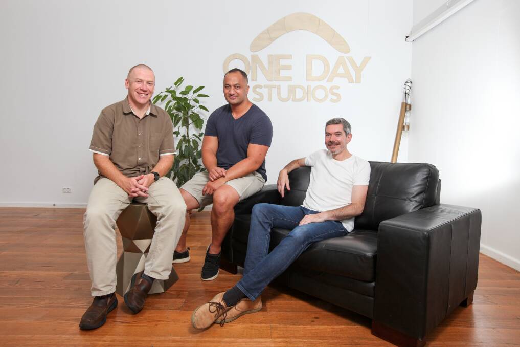 One Day Studio founders Dave McIntyre, Gareth Colliton and Richard Pritchard help Sierra Pritchard, 10 and are running classes to help people tell their stories through movies, animation and illustration. Picture: Rob Gunstone