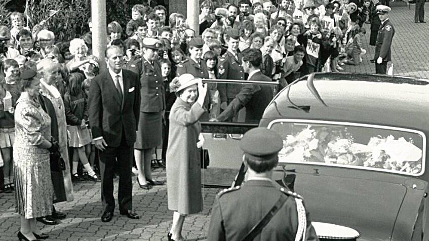 The Queen waves to well wishers at Tasmania's Burnie Civic Centre, where, in 1998, she officially proclaimed Burnie a city. 
