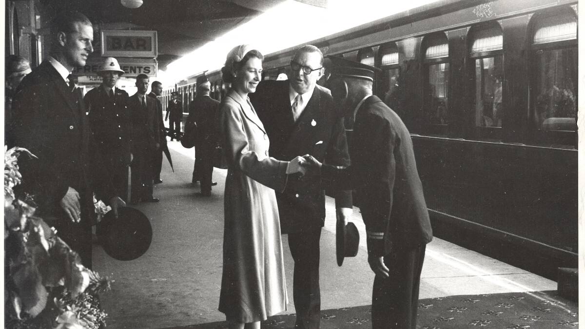The Queen shakes hands with station master Louis Le Breton at Bathurst Station as she prepares to board the Royal Train in 1954. 