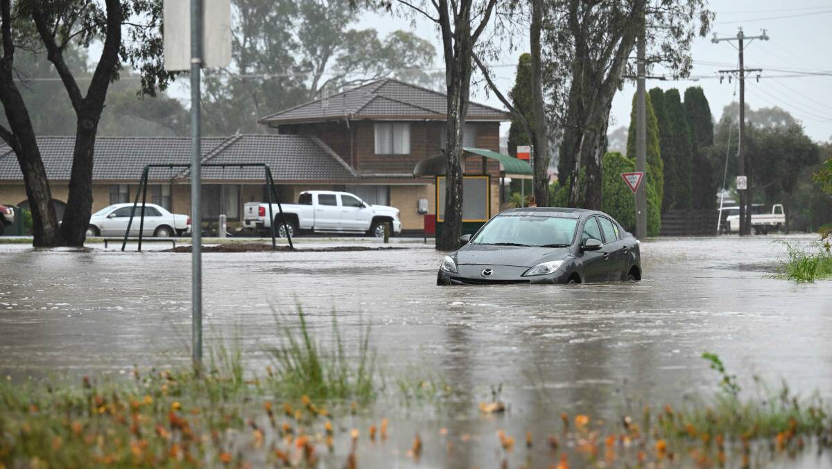 A partly submerged car is seen in Ascot, a northern suburb of Bendigo in Victoria. Picture by AAP Image/James Ross