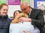 Scott Morrison kisses wife Jenny as he votes in Saturday's federal election. Picture: Getty Images