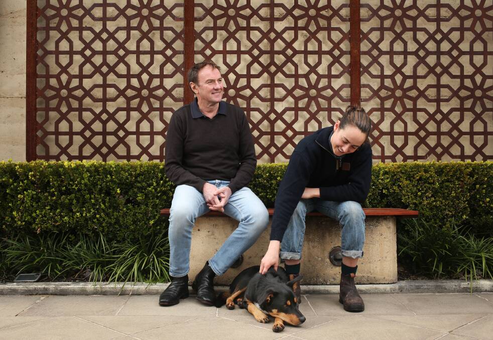 Next gen: Winemaker Andrew Margan with daughter Alessa Margan and Bonneau the dog at their family business, Margan Wines and Restaurant in Broke in the Hunter Valley. Picture: Simone De Peak