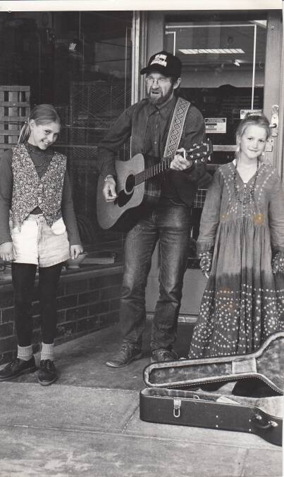 Behind The Mic (from left) Hannah, Michael and Rebecca Schack busking at the Folkie in 1995.
