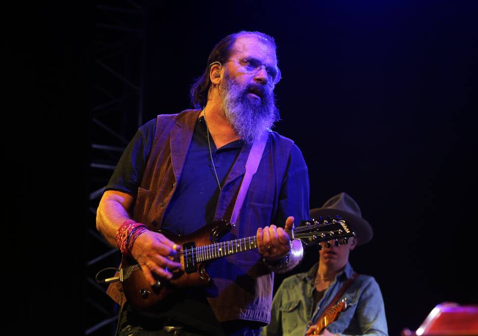 Hardcore Troubadour: American singer-songwriter Steve Earle plays a locally made Gilchrist electric mandolin during his set. Picture: Rob Gunstone