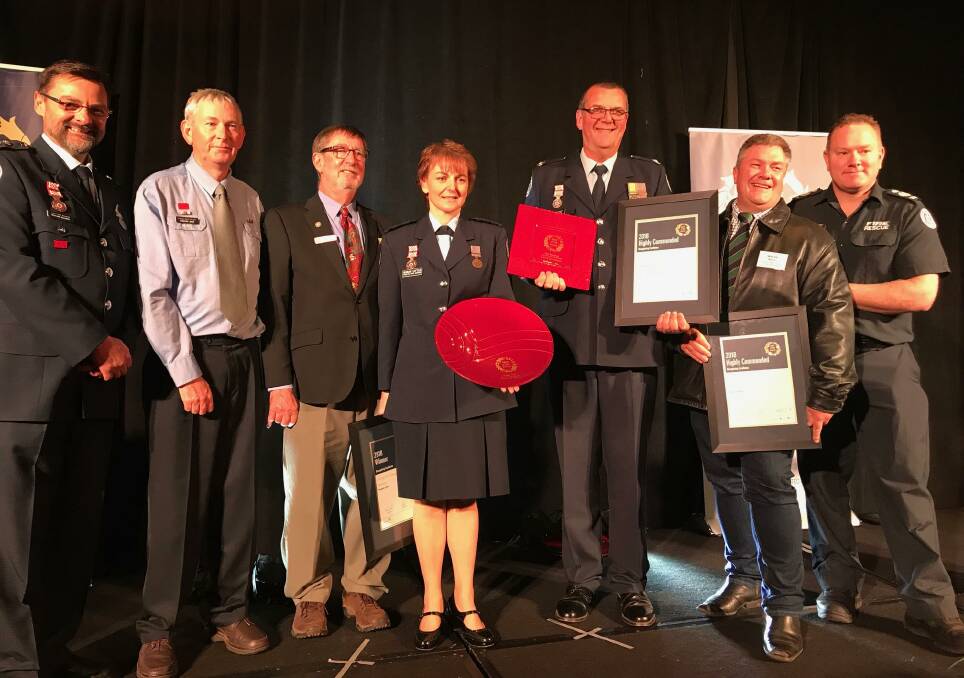 Award: Mortlake's Doug Parker (third from left) with Richard Bourke, Steve Lewis, Susan Little, Paul Marshall, Wayne Munroe and Andy Barry.