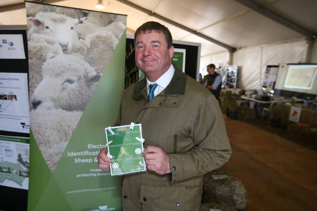Chief veterinary officer Charles Milne with the new EID tags. Picture: Morgan Hancock