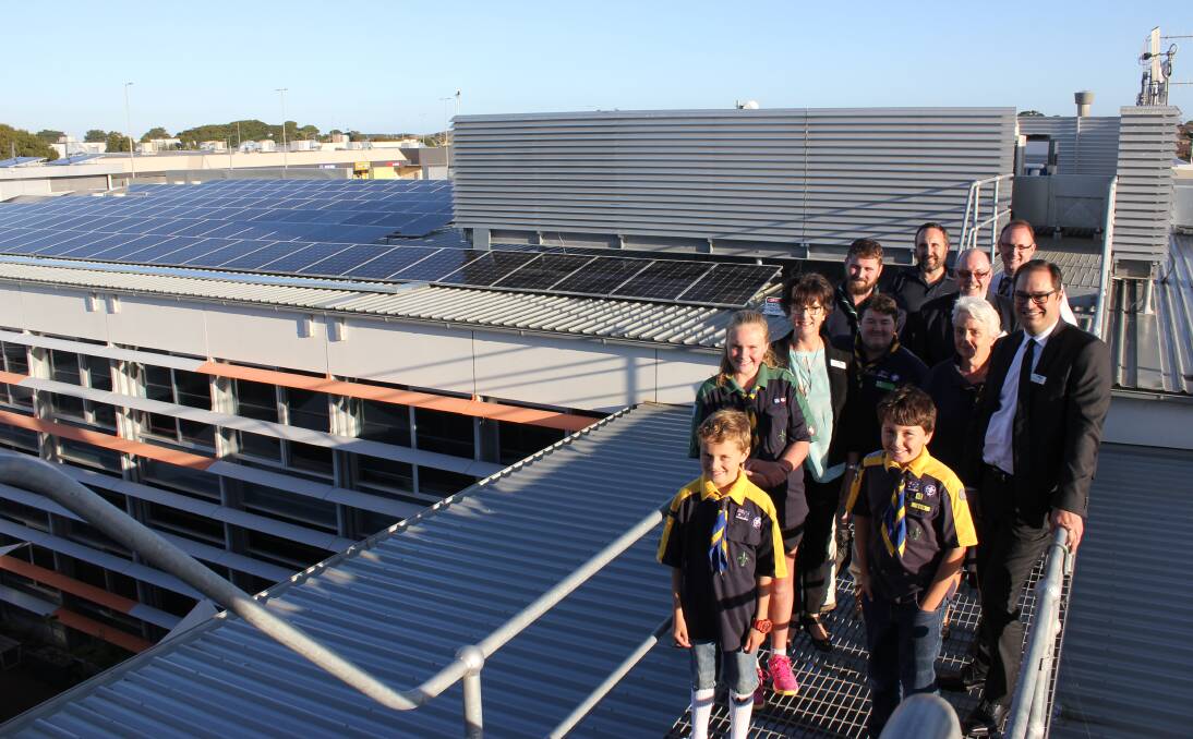 Wannon Water Board members, employees and south-west Scouts check out the new solar panels on the roof of the Gateway Road building.
