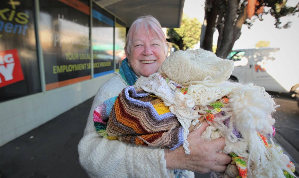 Western Plains Spinners and Weavers Craft Group's Barbara Porter holding a bundle of all things wool ahead of the group's annual show this weekend.