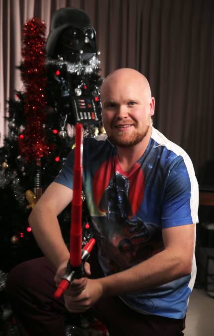 Fans awaken: Star Wars fan, and bachelor, Joel South has decorated his Christmas tree with characters from the franchise. Picture: Rob Gunstone