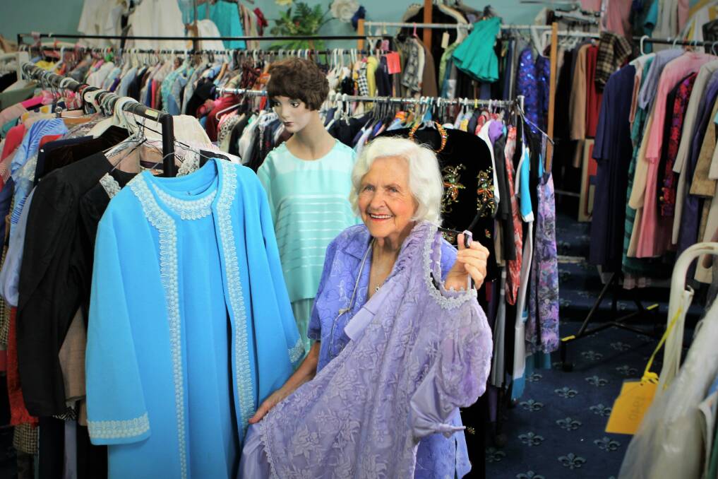 Every outfit tells a story: Dorothy Nicol with a mother of the bride's dress and a bridesmaid dress, some of the more than 2000 in her collection.