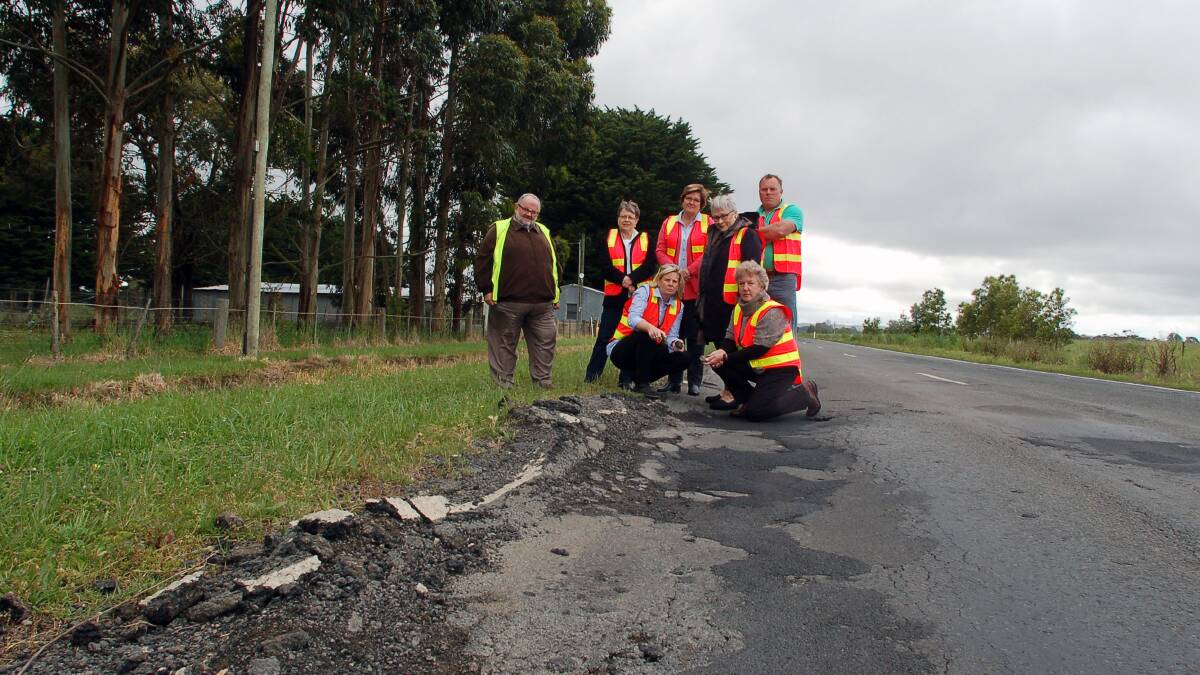 Rough ride: Corangamite Shire councillors Neil Trotter, Helen Durant, Jo Beard, Ruth Gstrein, Bev McArthur, Lesley Brown and Simon Illingworth on one of the shire's crumbling arterial roads.