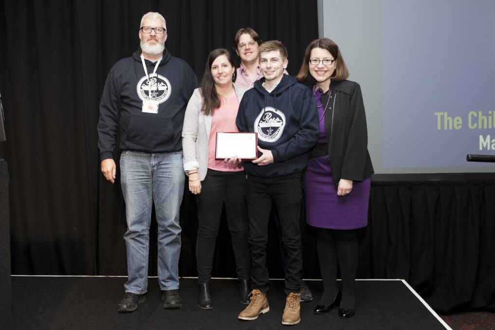 Award honour: Minister for Families, Children and Youth Affairs Jenny Mikakos (right) presenting the Excellence in Innovation and Team Work Award to the Mepunga team (from left) Pete Cheyne, Jennifer Ryan, Luke Annett and Alex Robertson.