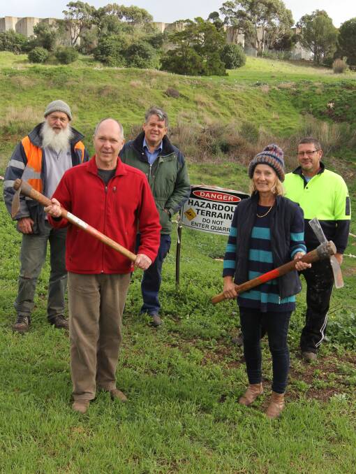 Ready for action: Warrnambool Community Garden members Chris Worrall, Bruce Campbell, Geoff Rollinson, Jennie Miller and David Stockdale at the quarry site.