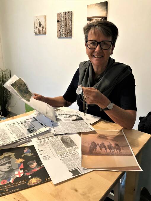 Legacy lives on: Warrnambool's Jenny Burchell with her grandfather Frank Wormald's dog tags. Mrs Burchell is in France with her daughter, Emma, tracing her grandfather's footsteps.