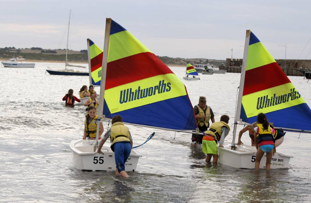 In the water: Koroit and District Primary School pupils head off in their boats for the Yachting Victoria sessions at Lady Bay. Picture: Rob Gunstone