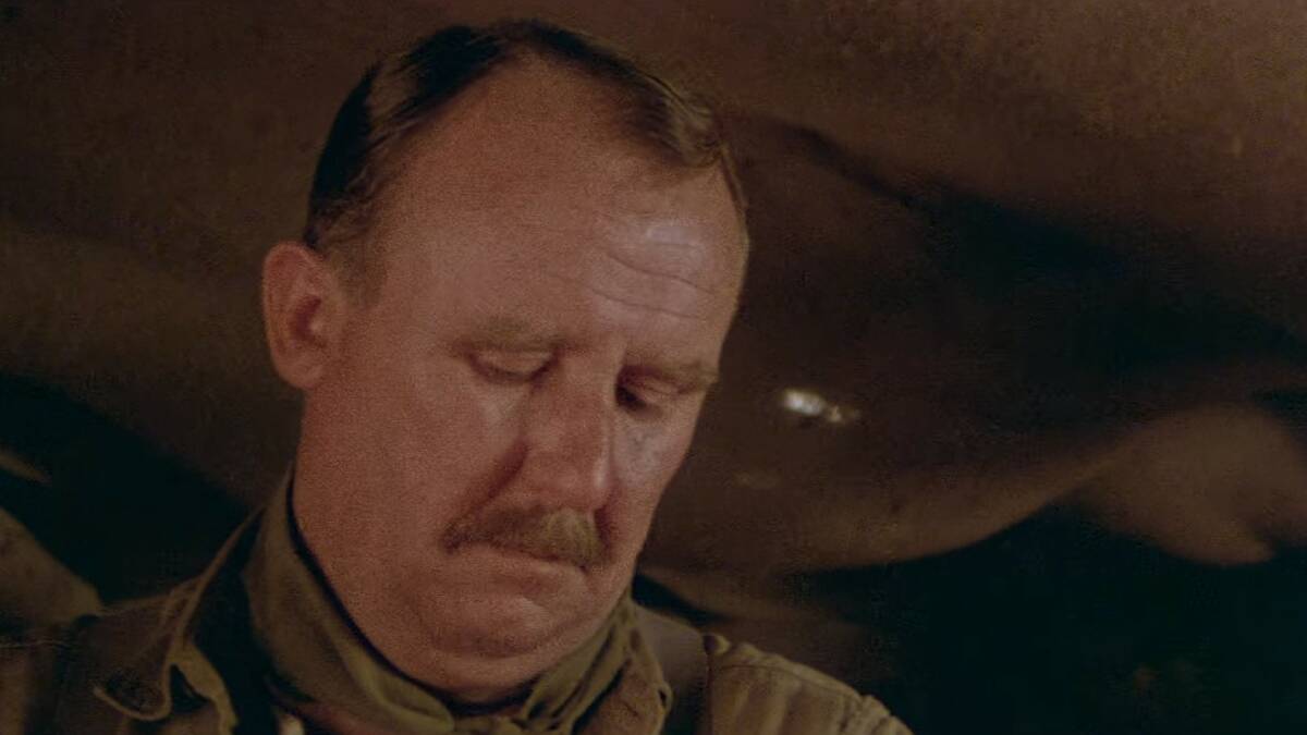 Time: Actor Bill Hunter looks down at his watch in Gallipoli, playing out the agonising situation Major Redford faced.