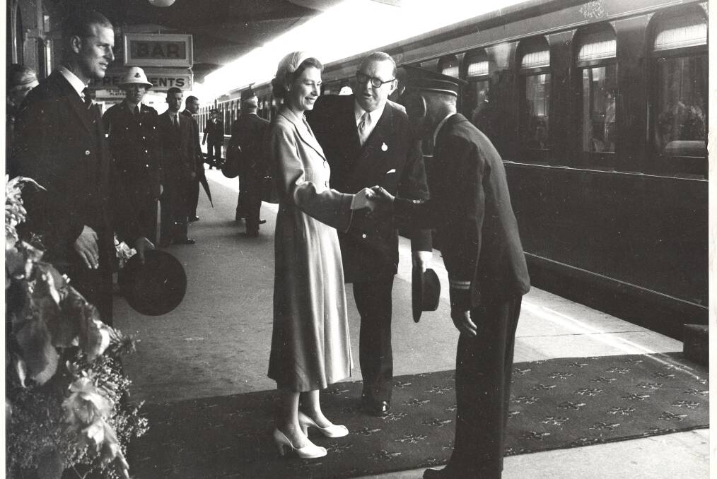 The Queen shakes hands with station master Louis Le Breton at Bathurst Station as she prepares to board the Royal Train in 1954. 