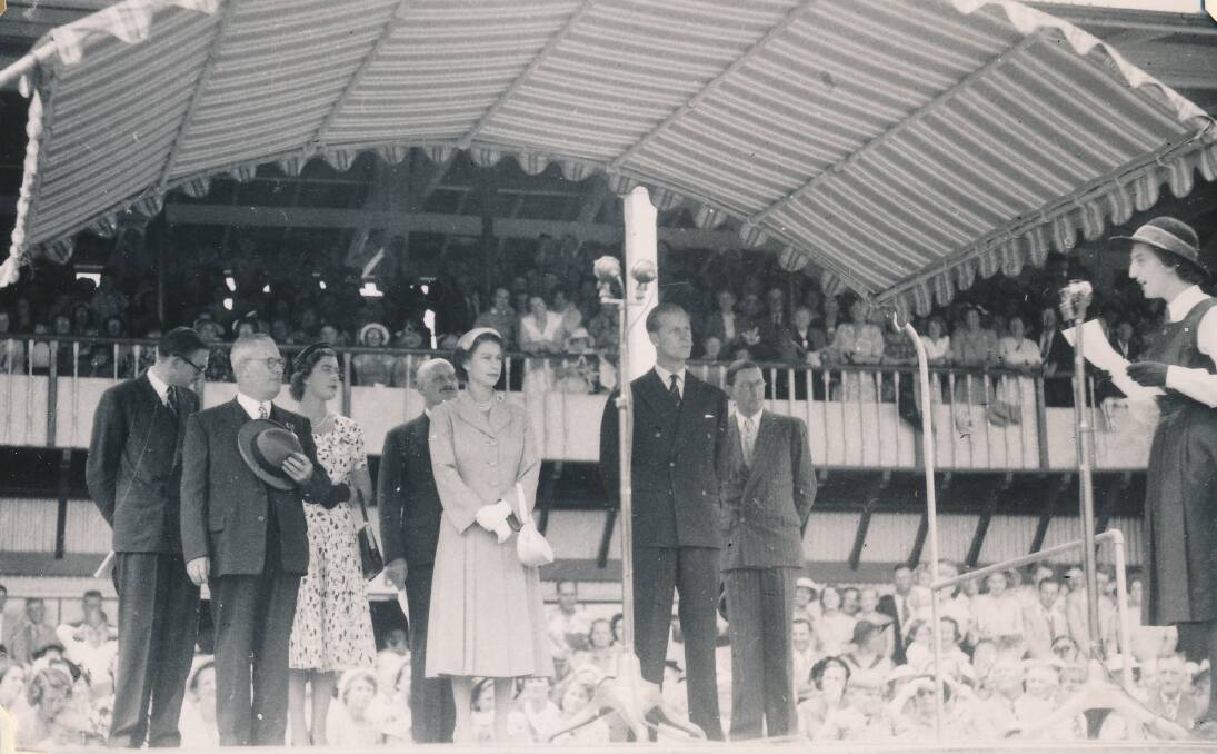 Queen Elizabeth II and the Duke of Edinburgh in front of the main grandstand at Bathurst Showground in 1954.