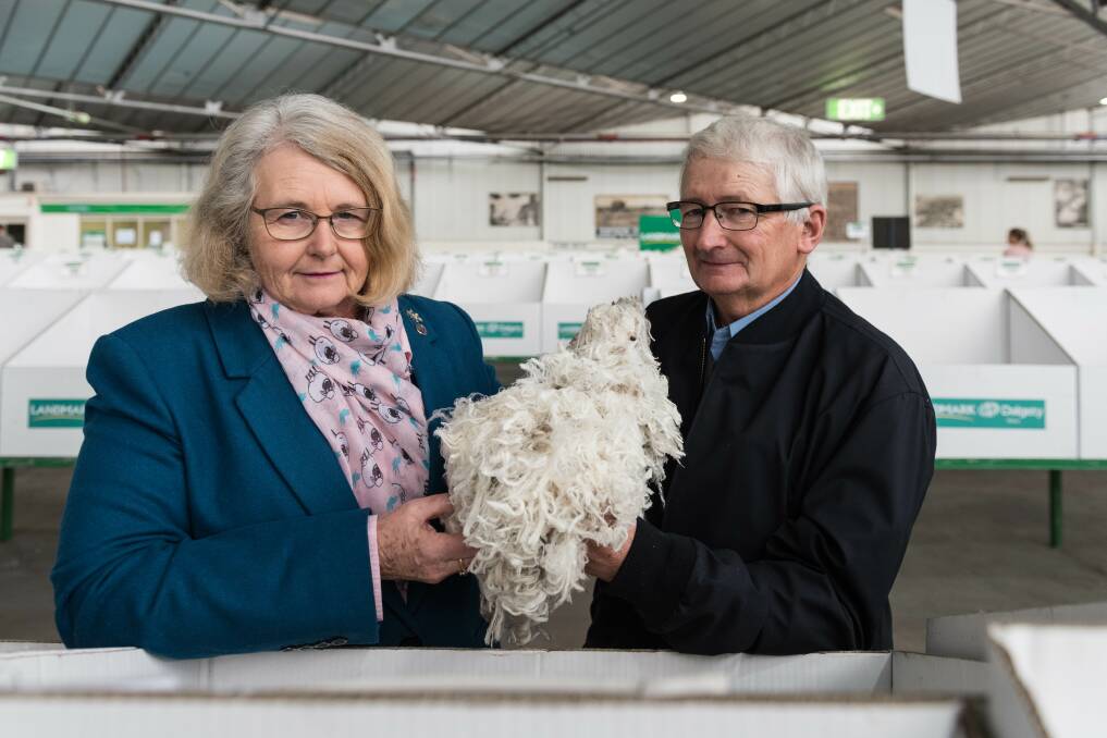 A FINE FLEECE: St Helens woolgrowers Sue and David Rowbottom from Rowensville Ultrafine Merino stud, at the Melbourne woolstores with some of their wool. Photos by Laura Ferguson.
