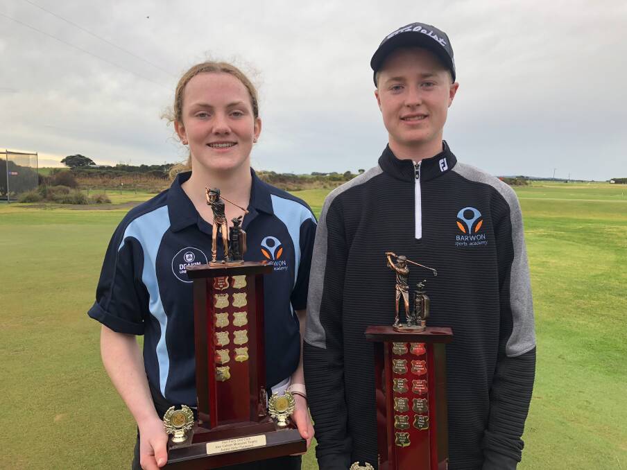 Winners are grinners: Isabella Marles, 14, and Matt McFarlane, 16, with their silverware from the Alec Calvert Junior Open. Picture: Gus McCubbing