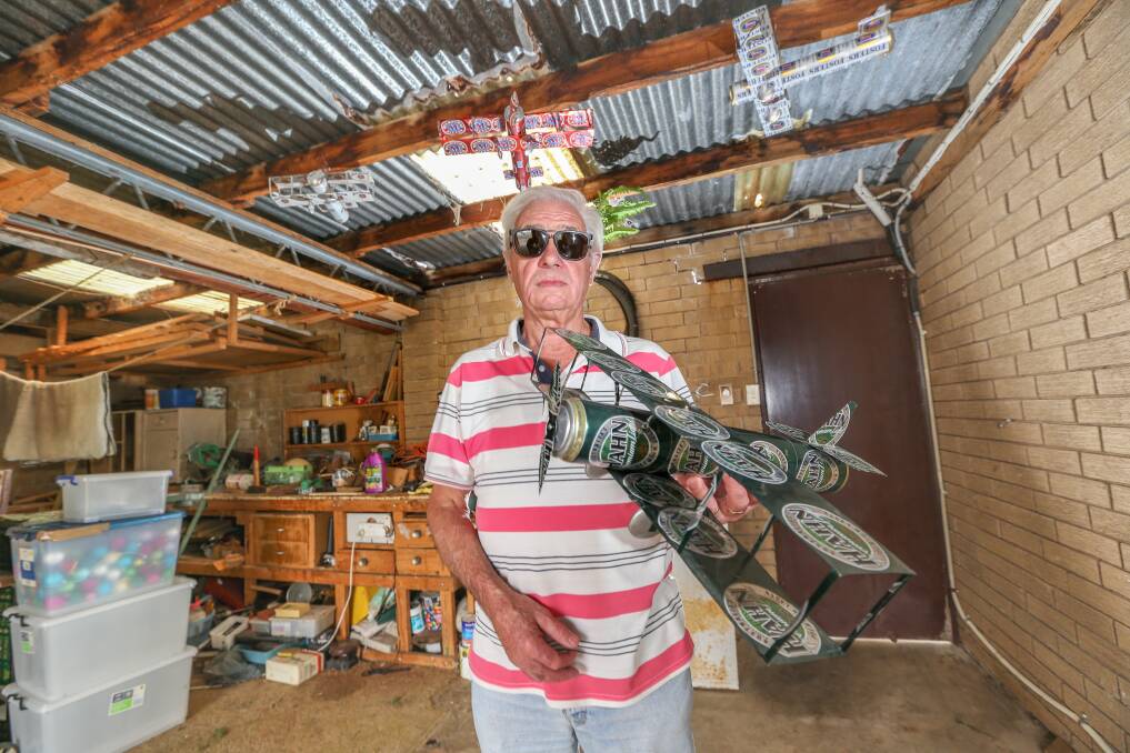 Allan Welch, 71, stands in his shed with some of the last few beer can planes his father made after a trove of them was stolen last week. Picture: Michael Chambers