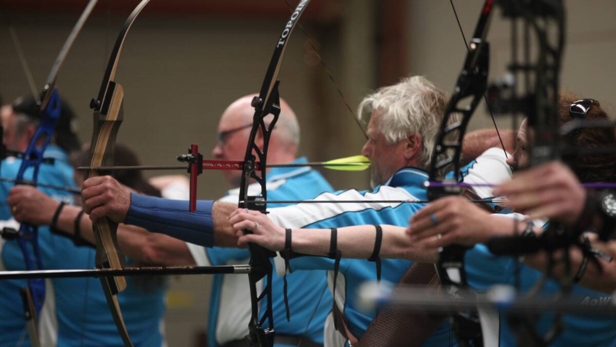 Still going: Archers of Warrnambool members draw their arrows as they aim for indoor targets. Club events are still going ahead amid the coronavirus pandemic. Picture: Nick Ansell 