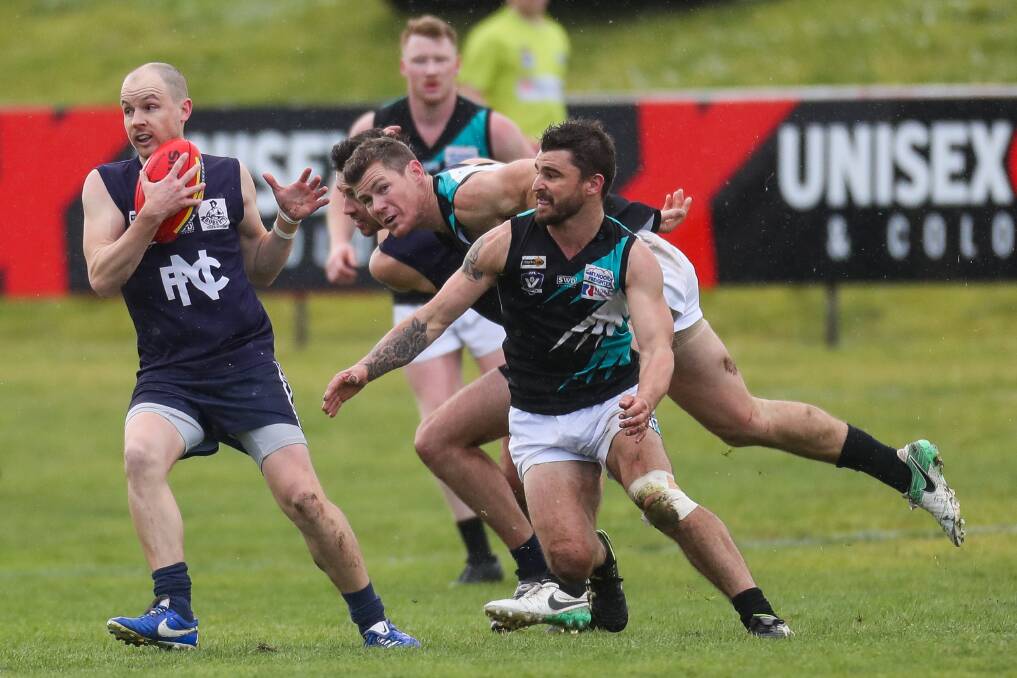 FINALS LOOMING: Nirranda's Brayden Harkness takes possession during the 2019 grand final against Kolora-Noorat. The league is planning to have the 2021 grand final at D.C. Farran Oval. Picture: Morgan Hancock 