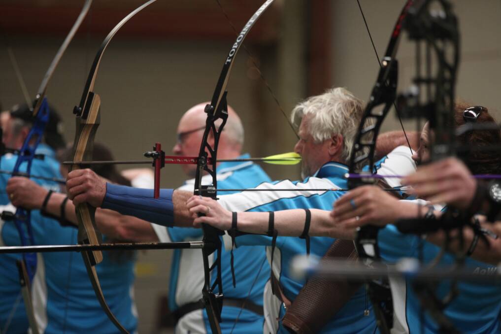 All set: Archers of Warrnambool members draw their arrows as they aim for indoor targets. Picture: Nick Ansell 