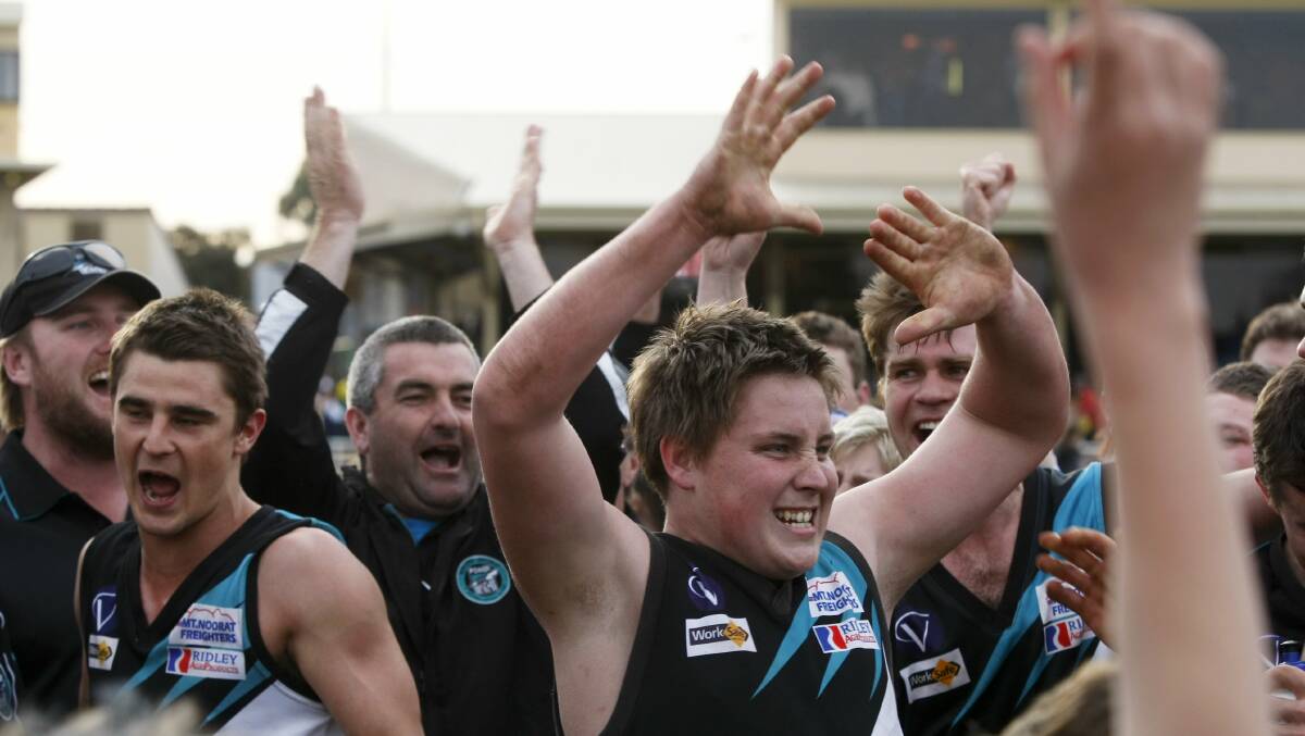Thrilled: Brad Johnson (left) and Mark Clissold (hands raised) during the celebrations after winning a third-straight grand final in 2011. Picture: Rob Gunstone