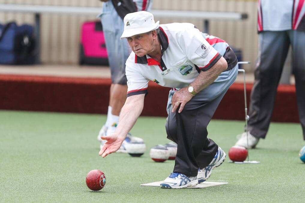 On the green: Dennington Dolphins' lead John Carey bowls against Warrnambool Blue on Tuesday. Picture: Morgan Hancock