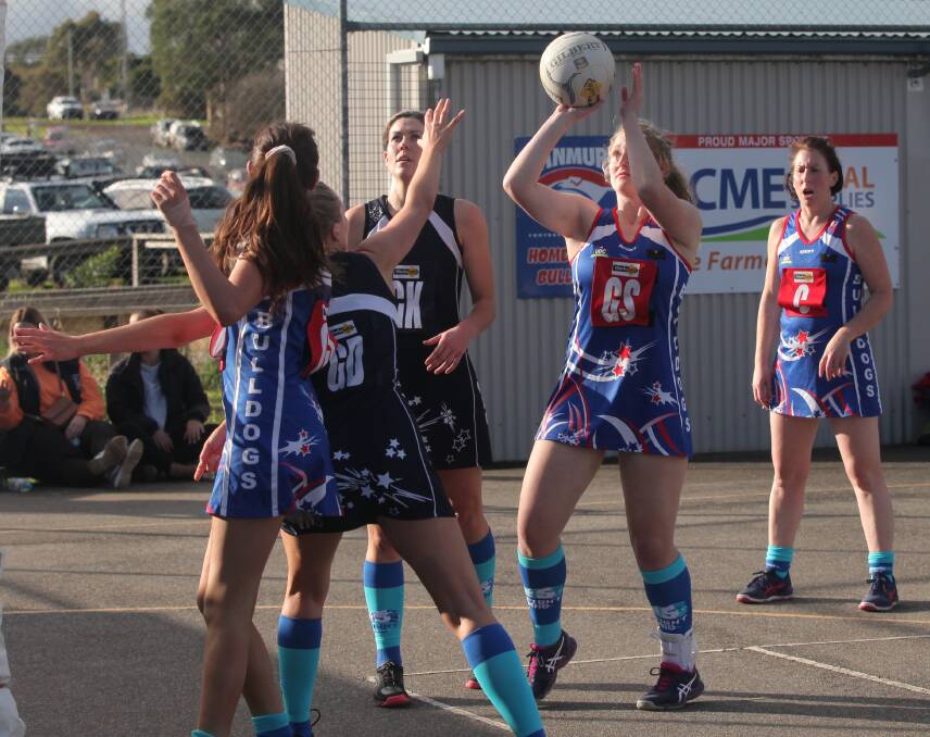 DEBUTANT: Panmure's Jacque Dickson shoots for goal during the Bulldogs' loss to reigning premier Nirranda on Saturday. She impressed in her first A grade game. Picture: Brian Allen 