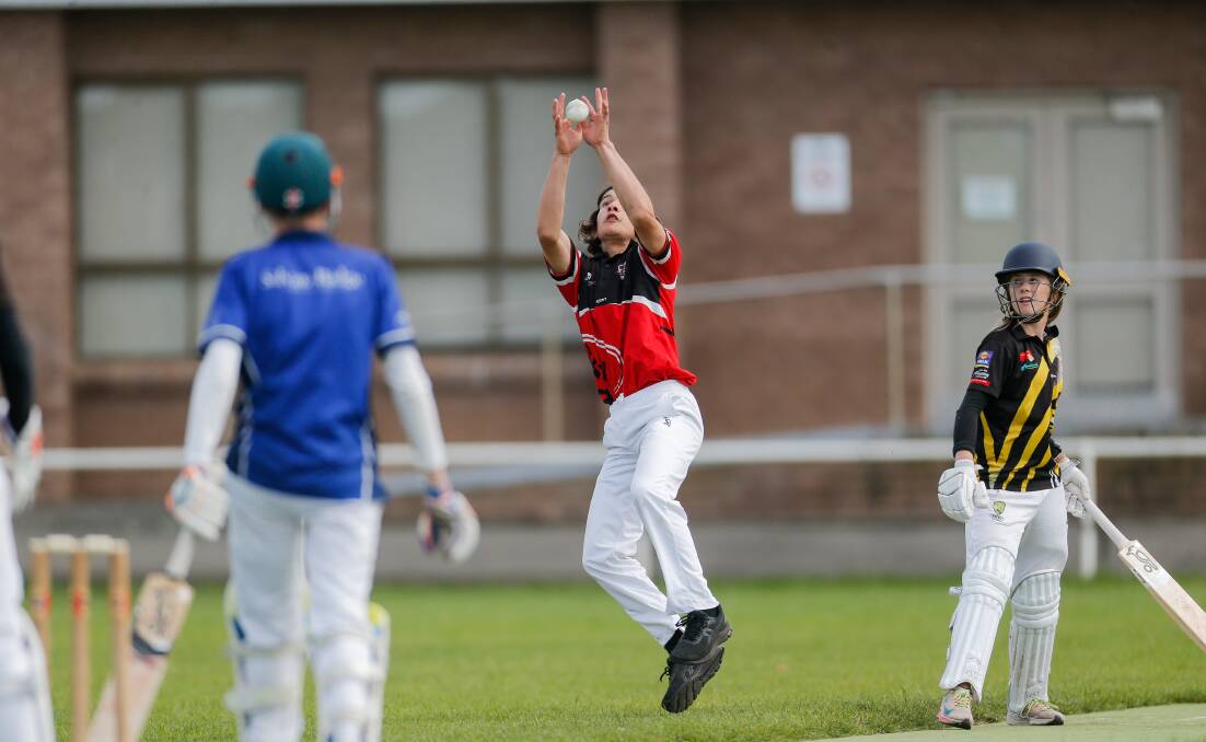 Good grab: Koroit's Dakota Davidson takes a catch as Merrivale-Russells Creek's Lila Wilkinson looks on during the WDCA under 15s game. Picture: Anthony Brady 