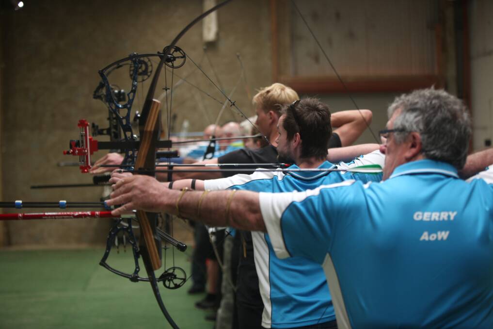 Lining it up: Archers of Warrnambool members draw their arrows as they aim for indoor targets. Picture: Nick Ansell