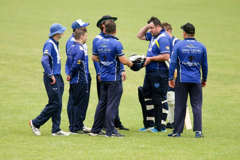 GOOD INNINGS: Russells Creek gather around Josh Campbell who finished 26 not out against Southern Titans on Saturday at Mack Oval. Picture: Chris Doheny 
