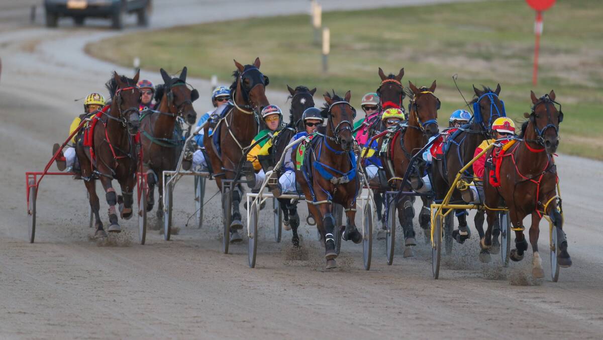 Powering along: Horses and drivers complete a lap at the Terang Harness Racing Club Track. Picture: Morgan Hancock
