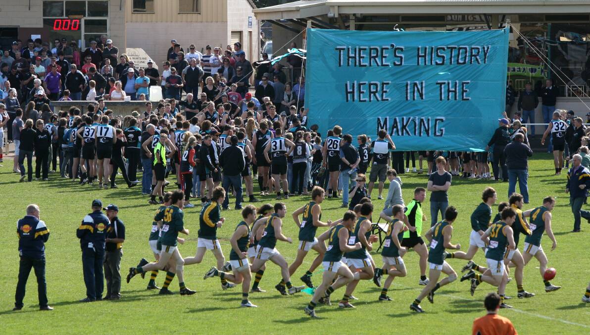History in the making: 2011 grand final day banner. Picture: Damian White 
