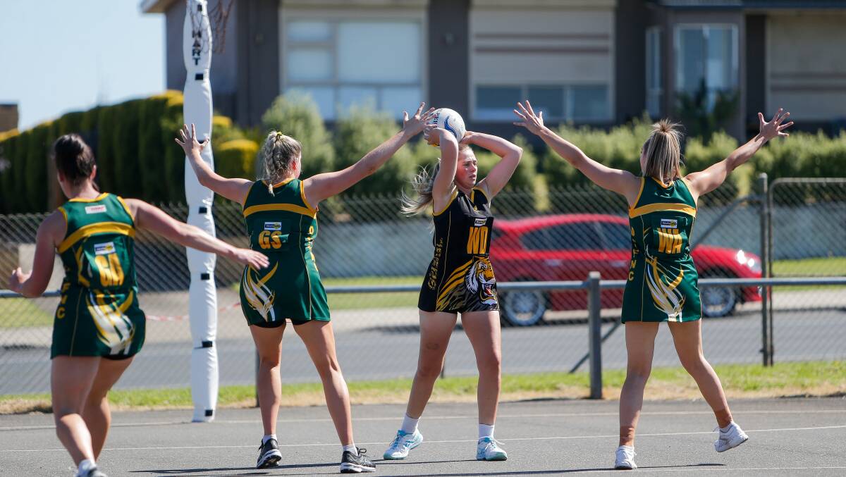FINDING PASS: Merrivale's Kelsey Perry assesses her options during the opening match of the season against Old Collegians. Picture: Anthony Brady 