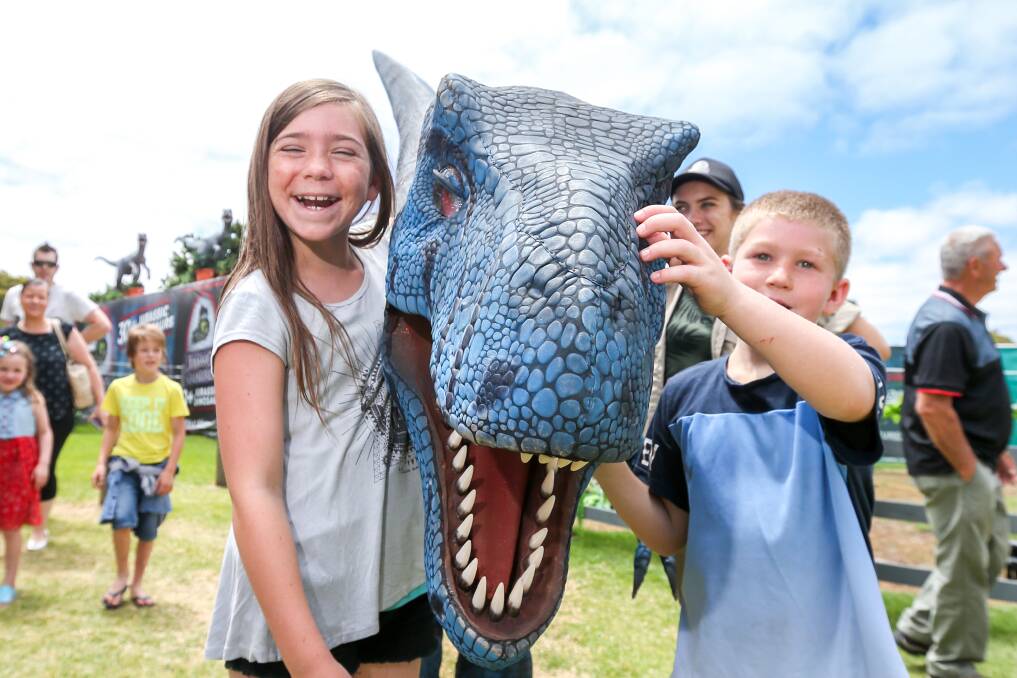All smiles: Emily (11) and Jack (8) Digmey with Blue the dinosaur at the Jurassic Creatures exhibition.

