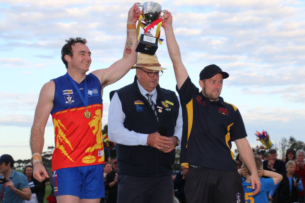 Victory: Great Western captain Nigel Sibson and coach William Bell lift the premiership cup after the game. Picture: Tracey Kruger