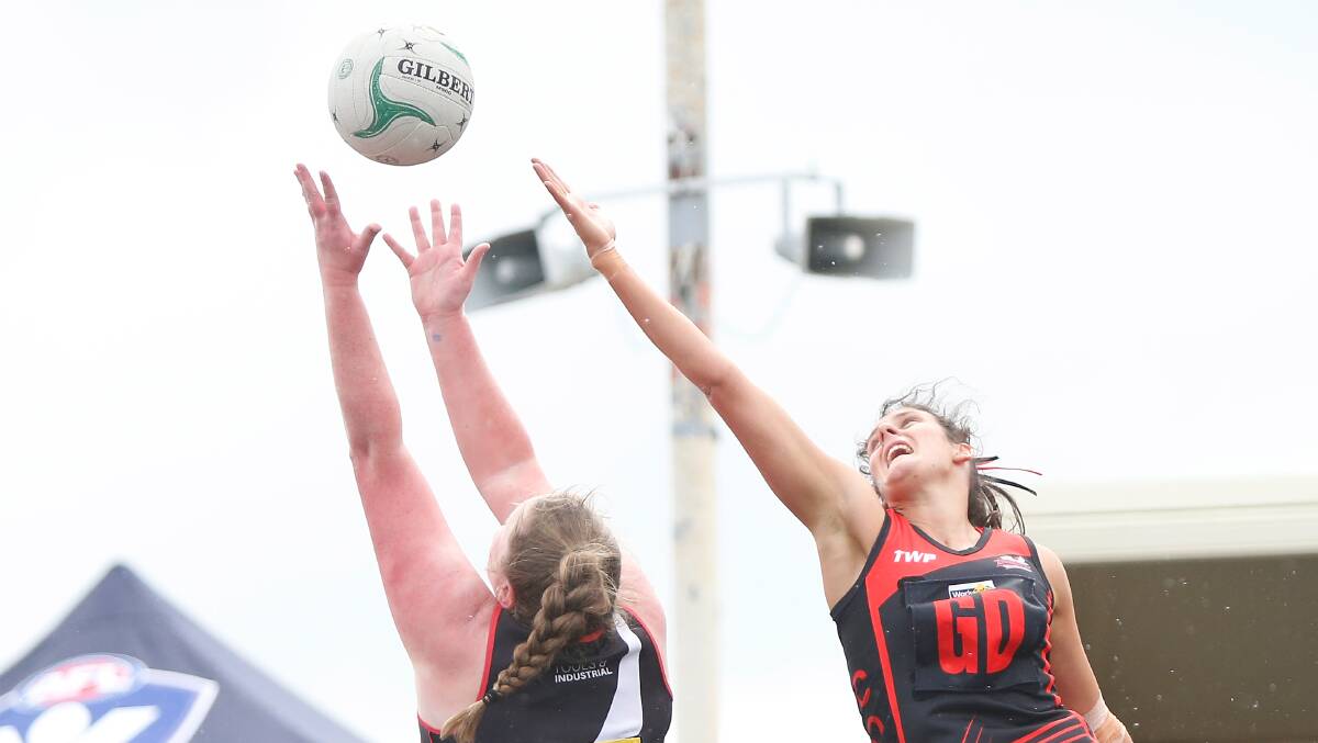 Top guns: Cobden's Jessica Wheadon reaches for the ball as Koroit's Nell Mitchell goes to catch during the 2019 Hampden league grand final. Picture: Mark Witte