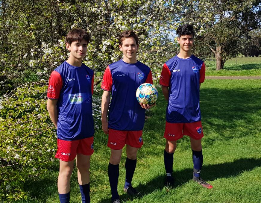 BROTHERS: Gabriel, 13, Daniel, 17, and Joseph Lim, 15, display the SWVFA's new representative uniform. Daniel and Joseph are in the under 17 boys' team and Gabriel is in the under 15 boys' side.