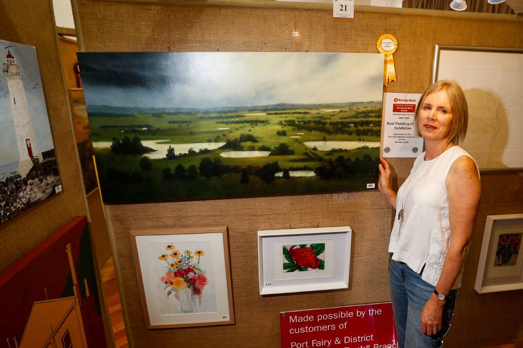 Well done: Judy Rauert with her work South West Vista which won best painting of the exhibition at the Lions Art Show.