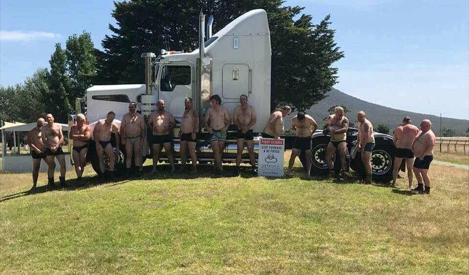 Team effort: A group of south-west truck drivers gathered at Dunkeld Racecourse for a calendar photo shoot to help reduce the stigma associated with mental health.