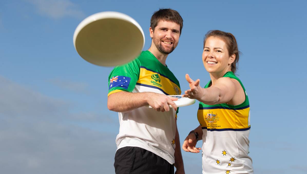 In flight: Former Australian Ultimate Frisbee players, Dallas Jones and Amy Meehan. Indoor Ultimate Frisbee has returned on Monday nights at Brauer College, Warrnambool. Picture: Chris Doheny 