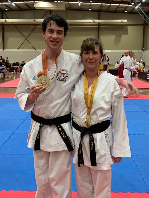 Family success: Tobi Cole and his mum, Jill, with their medals at the National All Styles Karate Championships. 