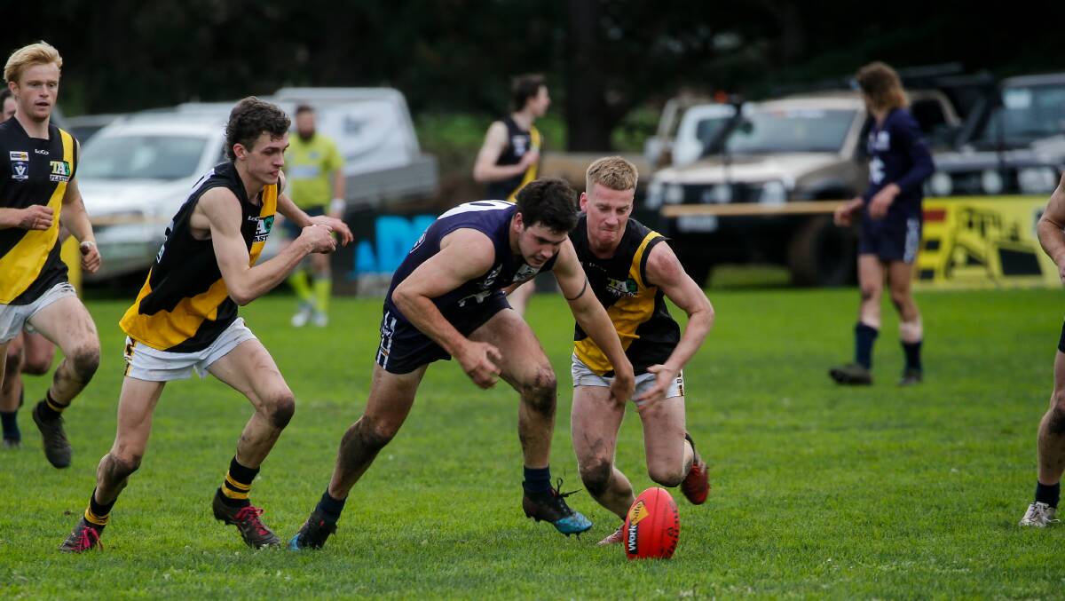 Injured: Nirranda's Max Primmer leads the chase for the ball during the Nirranda versus Merrivale game. He sustained a quad injury. Picture: Anthony Brady