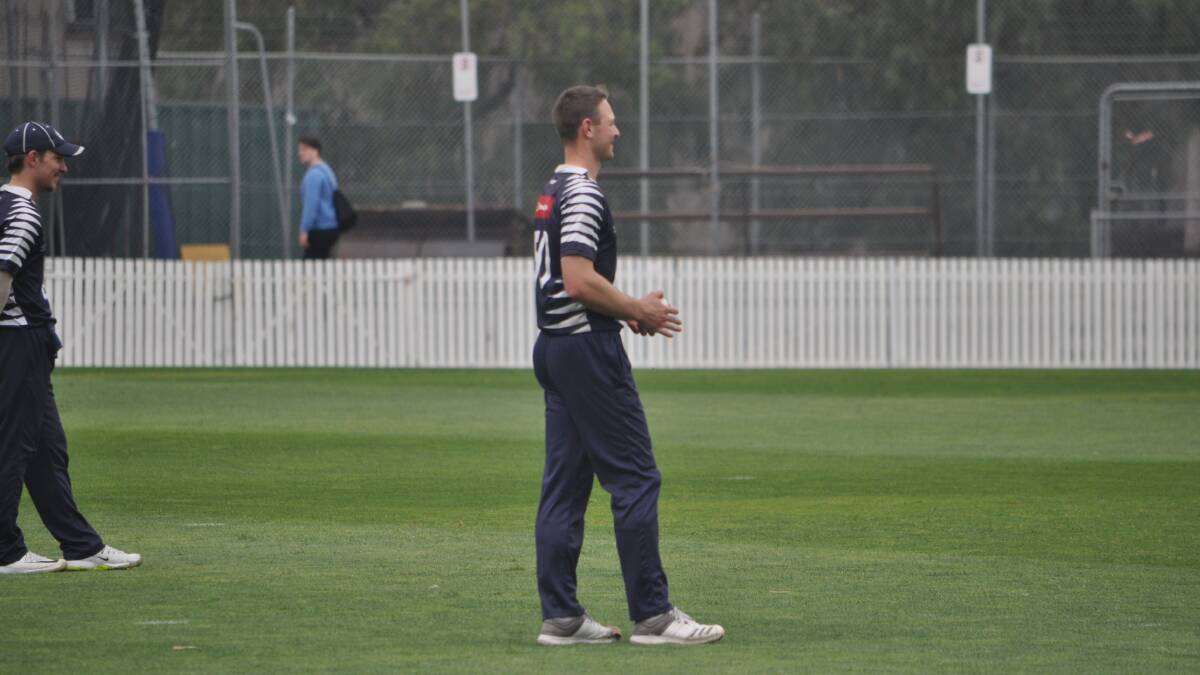 Set to bowl: Paceman Brody Couch at the start of his run up against Melbourne University.