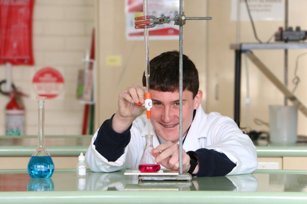 Experiment: Year 12 student Jacob Gome in a laboratory at Emmanuel College. He placed fifth in Australia in the 2020 Australian Science Olympiad for chemistry.