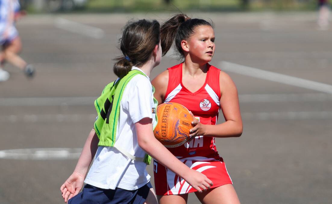 SEARCHING FOR TEAMMATES: South Warrnambool's Evie McCosh gains possession of the ball in the 13 and under match during the 2020 Christmas Cup. Picture: Morgan Hancock